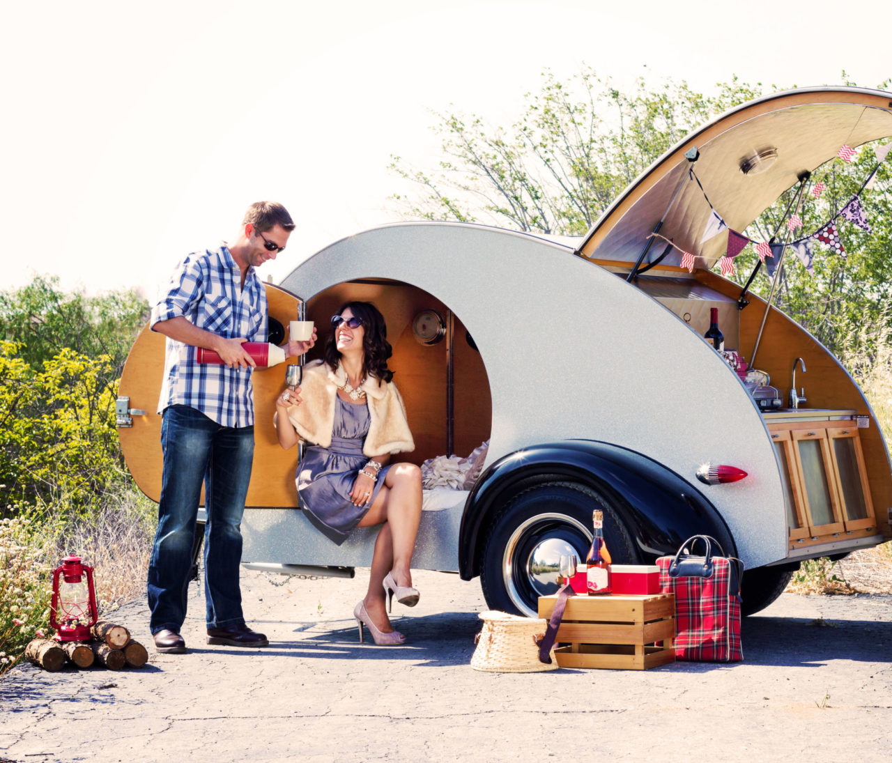 Man and woman glamorously camping